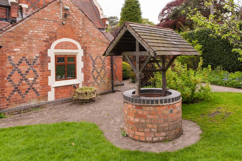 Old, bricked well in a garden. Old, bricked well in a garden.