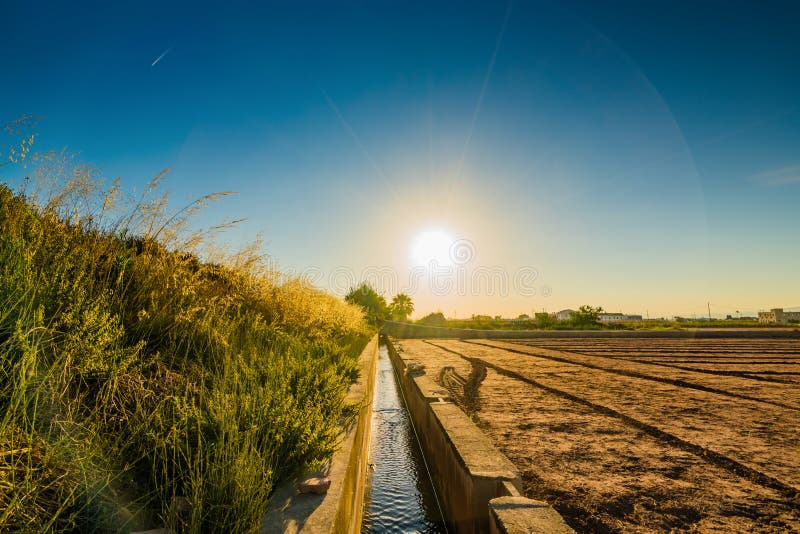 View of agricultural fields and buildings near Valencia before sunset. Spain stock photography View of agricultural fields and buildings near Valencia before sunset. Spain stock photography