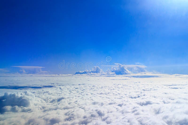The View from the Airplane Window on the Clouds and Blue Sky. Tourism and  Travel. Wallpaper, Texture. Aerial Photography Stock Photo - Image of blue,  high: 185643040
