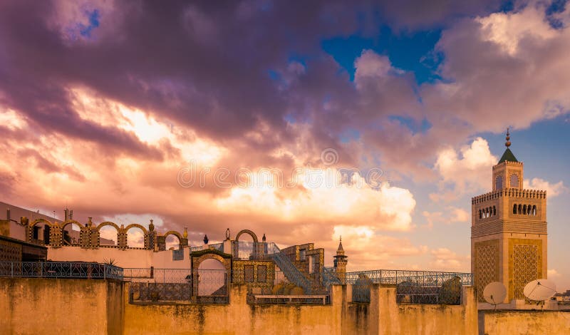 View of the Al-Zaytuna Mosque and the skyline of Tunis at dawn. The mosque is a Landmark of Tunis. Tunisia, North africa.