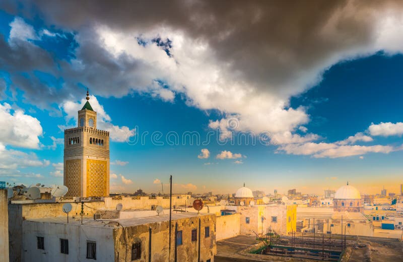 View of the Al-Zaytuna Mosque and the skyline of Tunis at dawn. The mosque is a Landmark of Tunis. Tunisia, North africa.