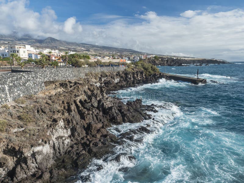 View of Alcala village, part of Guya de Isora municipality, with traditional architecture and sharp lava rock coast with