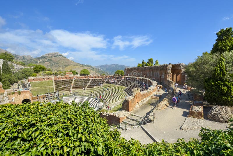 View of the ancient theatre of Taormina, Italy, on the Mediterranean island of Sicily stock photos View of the ancient theatre of Taormina, Italy, on the Mediterranean island of Sicily stock photos