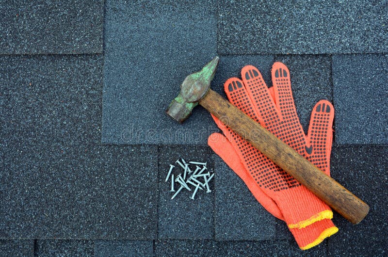 Asphalt Roofing Shingles Hammer, Gloves and Nails. stock image. 