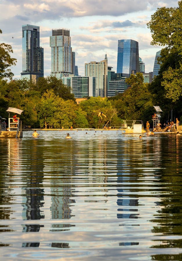 View of the Austin skyline at sunset over Barton Springs swimming pool royalty free stock photo