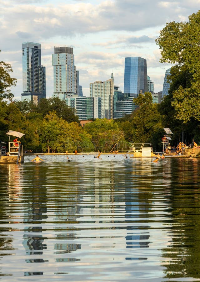 View of the Austin skyline at sunset over Barton Springs swimming pool stock photography