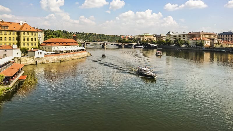 View banks of the Vltava River , tourist boats and the Manesuv Bridge in the historical center of Prague, Czech Republic. royalty free stock photos View banks of the Vltava River , tourist boats and the Manesuv Bridge in the historical center of Prague, Czech Republic. royalty free stock photos