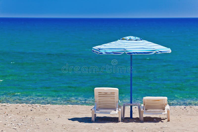 View of the beach with chairs and umbrellas