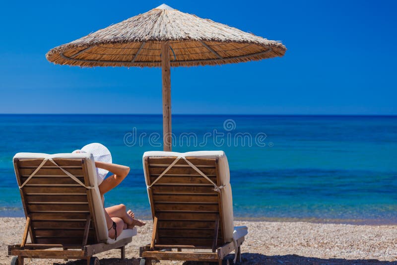 View of the beach with chairs and umbrellas