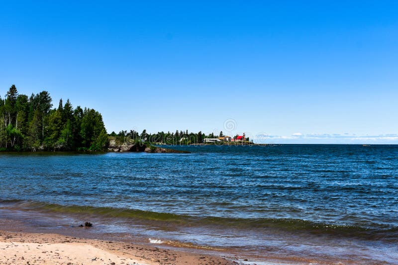 View from the Beach of Eagle Harbor Lighthouse Michigan on Lake