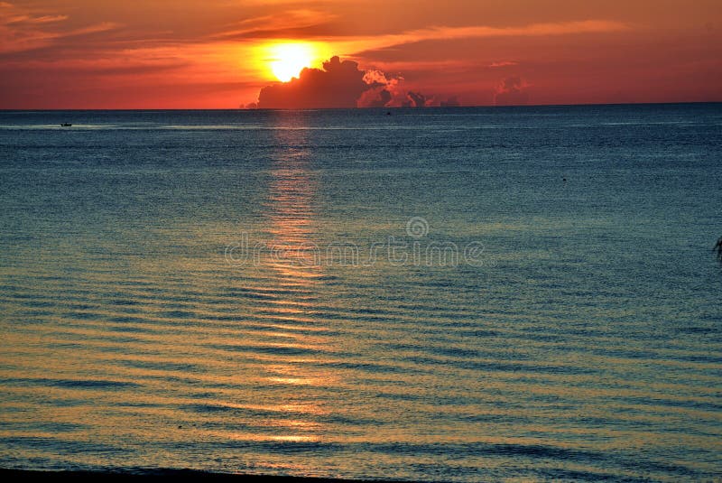 View from the beach of sunrise with cloud cover stock image View from the beach of sunrise with cloud cover stock image