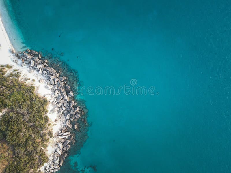 View of a beautiful beach with clear turquoise waters and rocky coastline on Zakynthos Island stock photos