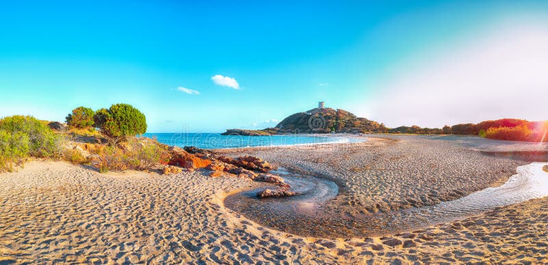 View of beautiful Chia bay and wonderful beach with Torre di Chia tower