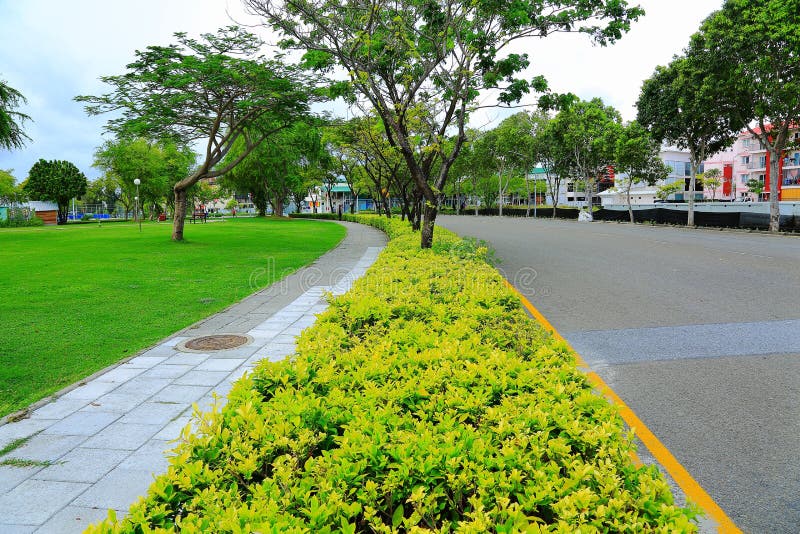 View of beautiful street with green trees and green lawn. Hulhumale Island, Beautiful landmark backgrounds. royalty free stock photo View of beautiful street with green trees and green lawn. Hulhumale Island, Beautiful landmark backgrounds. royalty free stock photo