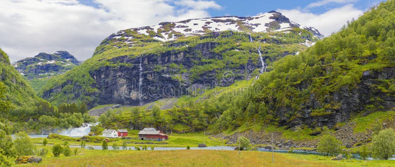 View Beautiful sunrise scene over mountain and fjord