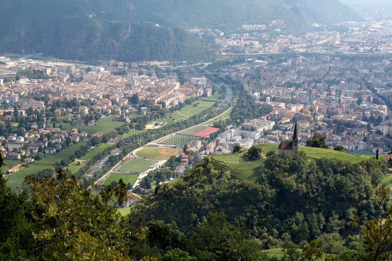 Bolzano or Bozen, capital of the province of Bolzano-Bozen, is a city and commune in the Trentino-Alto Adige/Sudtirol region of Italy. The river Talvera or Talfer divides the town in two parts. On the left the cathedral. Bolzano or Bozen, capital of the province of Bolzano-Bozen, is a city and commune in the Trentino-Alto Adige/Sudtirol region of Italy. The river Talvera or Talfer divides the town in two parts. On the left the cathedral.