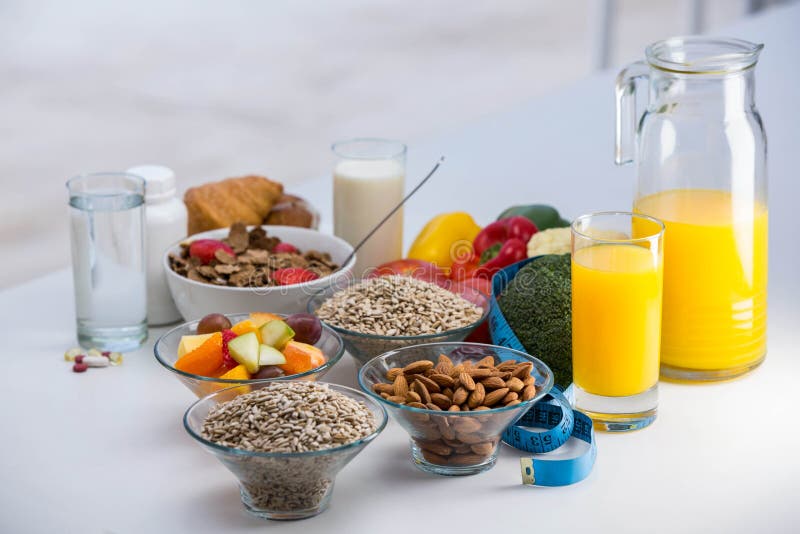 View of bowl of cereals, fruit salad and food