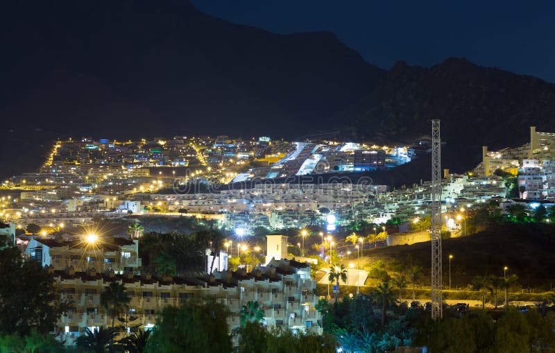 View the city at night with palm trees. Tenerife, Spain. View the city at night with palm trees. Tenerife, Spain.