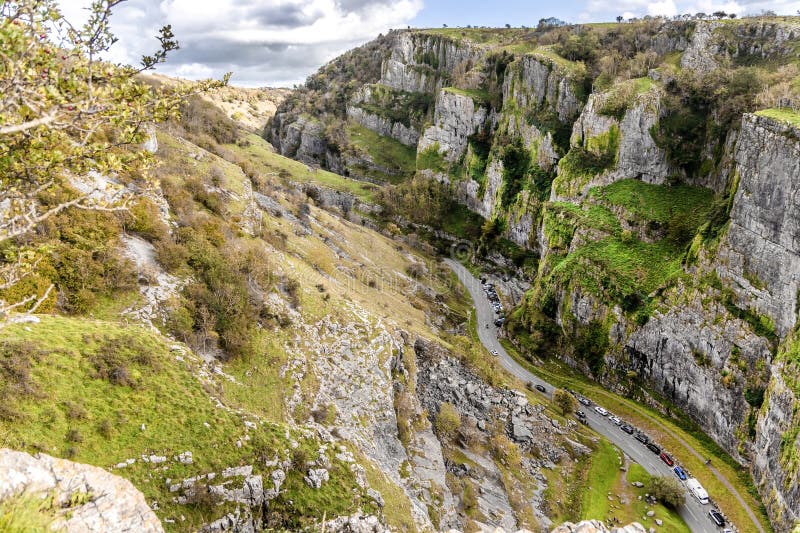 View from cliffs edge of winding road cars Cheddar Gorge in Somerset stock photo