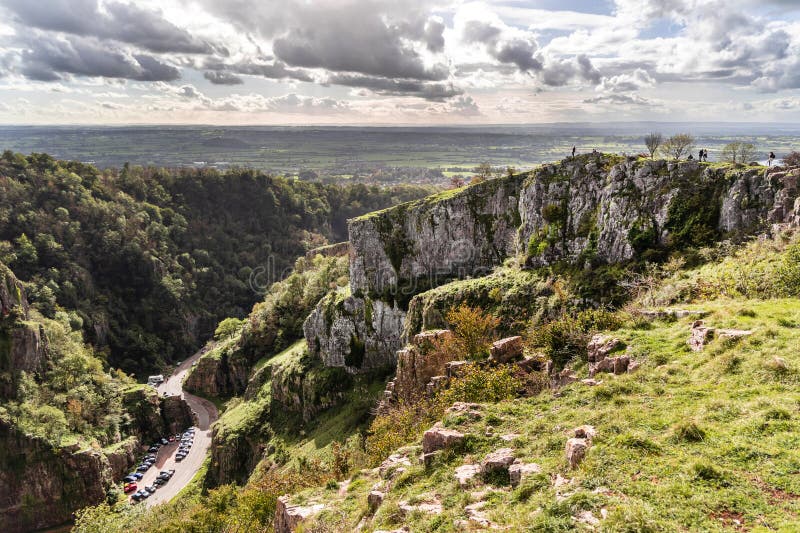 View from cliffs edge of winding road Cheddar Gorge in Somerset stock images