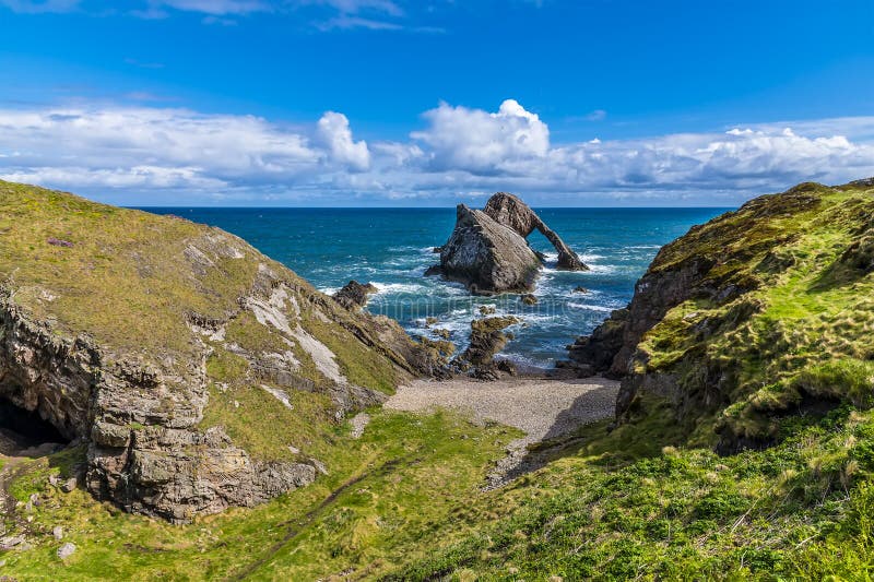 A view of the cliffs and the impressive Bow Fiddle Rock at Portknockie, Scotland on a summers dayy