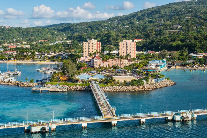 View of the Cruise Terminal in Ocho Rios, Jamaica. Ocho Rios, Jamaica - April 22, 2019: View from the ship to the Cruise terminal in the tropical Caribbean stock photography View of the Cruise Terminal in Ocho Rios, Jamaica. Ocho Rios, Jamaica - April 22, 2019: View from the ship to the Cruise terminal in the tropical Caribbean stock photography