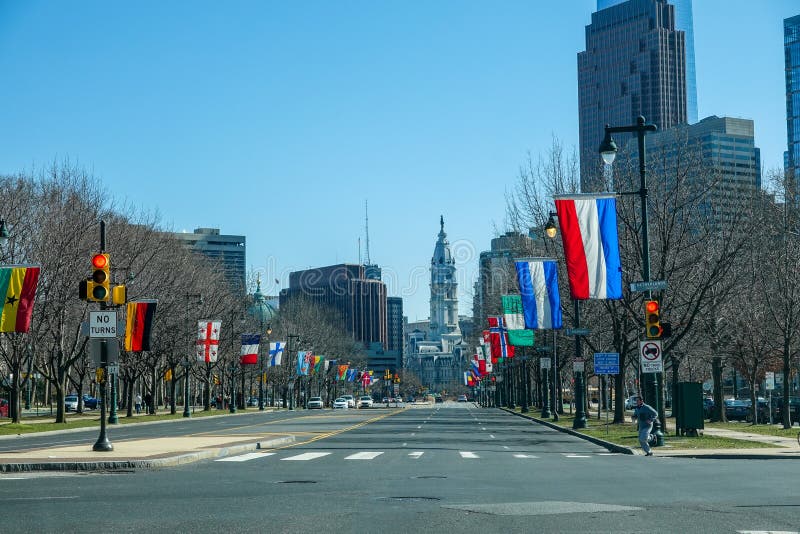 A view down an empty deserted Benjamin Franklin Parkway towards City Hall with its statue of William Penn