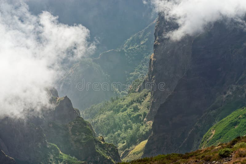 View down from mountain peak at a valley in the distant