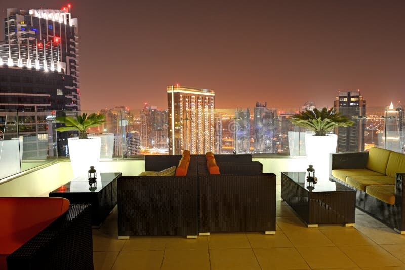 The view on Dubai city from skyscraper in night illumination