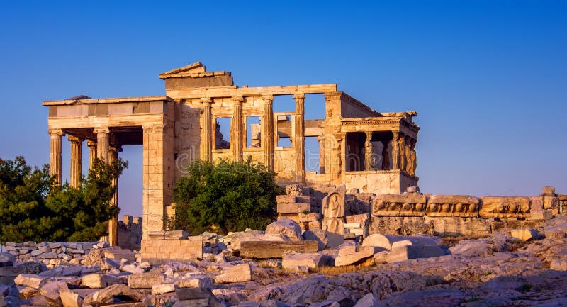 View of Erechtheion and porch of Caryatids on Acropolis, Athens, Greece, at sunset stock photography View of Erechtheion and porch of Caryatids on Acropolis, Athens, Greece, at sunset stock photography