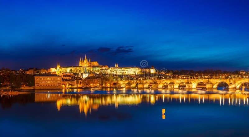 View of Charles Bridge Karluv most and Prague Castle Prazsky hrad in twilight. Panorama