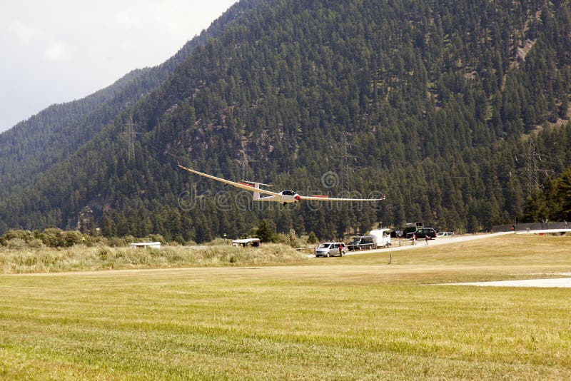 A view of a flying glider in the airport of St Moritz in the alps switzerland royalty free stock image A view of a flying glider in the airport of St Moritz in the alps switzerland royalty free stock image