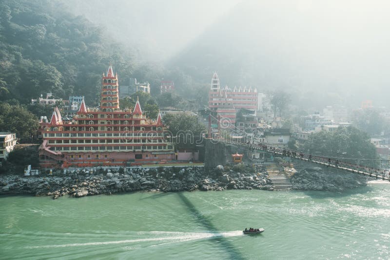View of Ganga river embankment, Lakshman Jhula bridge and Tera Manzil Temple, Trimbakeshwar in Rishikesh.