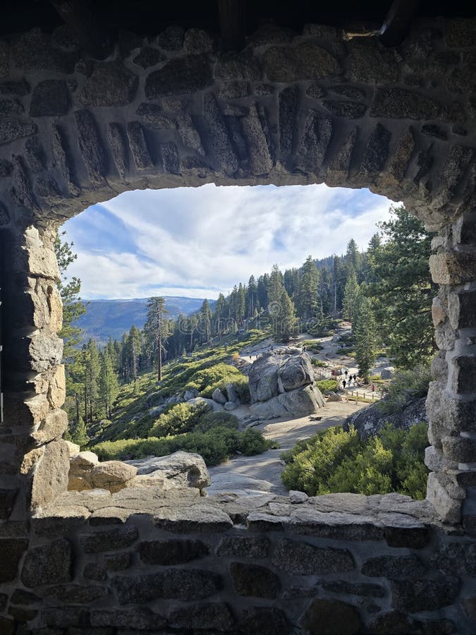View Of Green Hillside Through Stone Archway royalty free stock photo