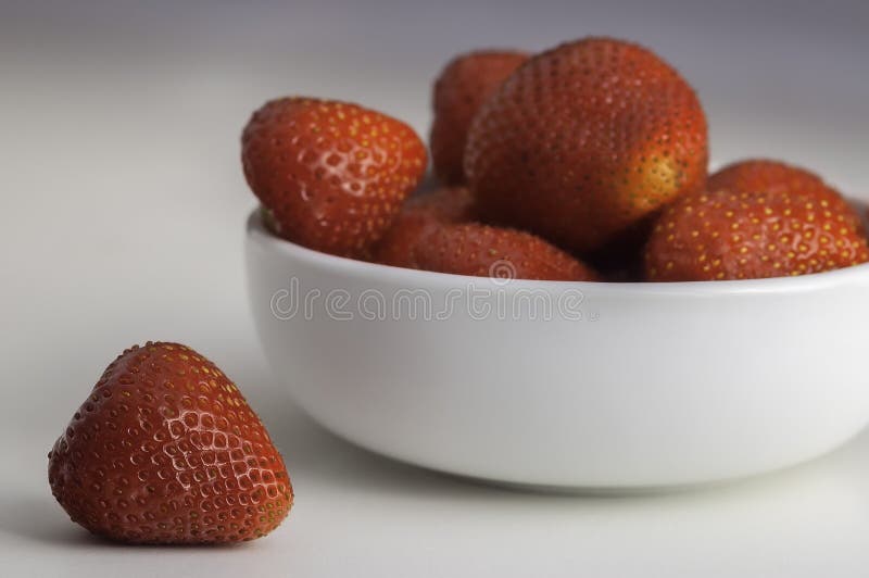 Strawberry in bowl stock photography
