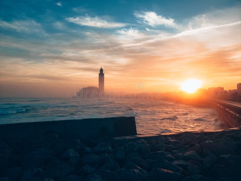 view of the Hassan II Mosque seen from the wall alley at sunrise - Casablanca, Morocco