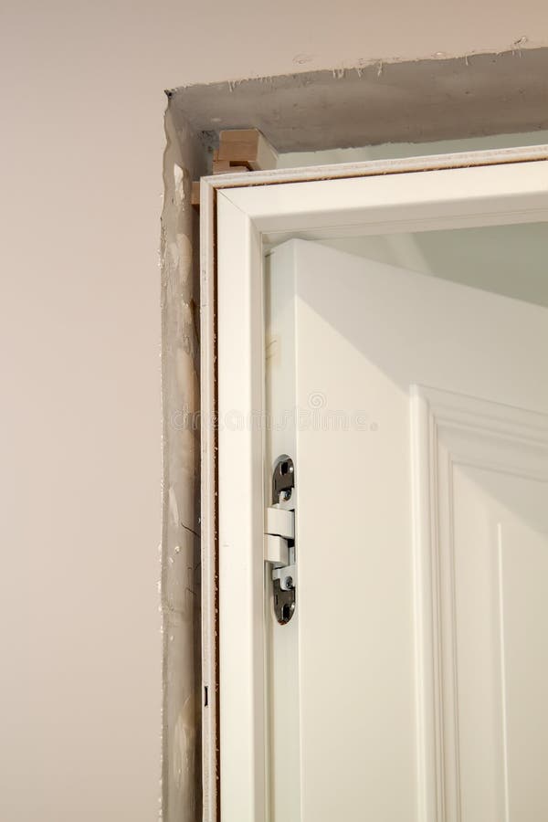 View of the Installation of the Door in the Doorway and Hidden Door