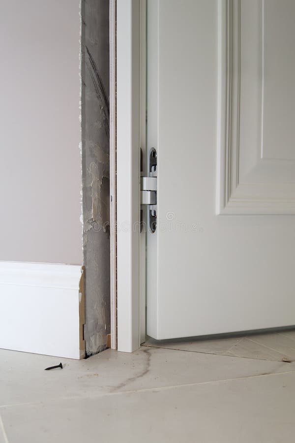 View of Installation of the Door in the Doorway and Hidden Door Hinge