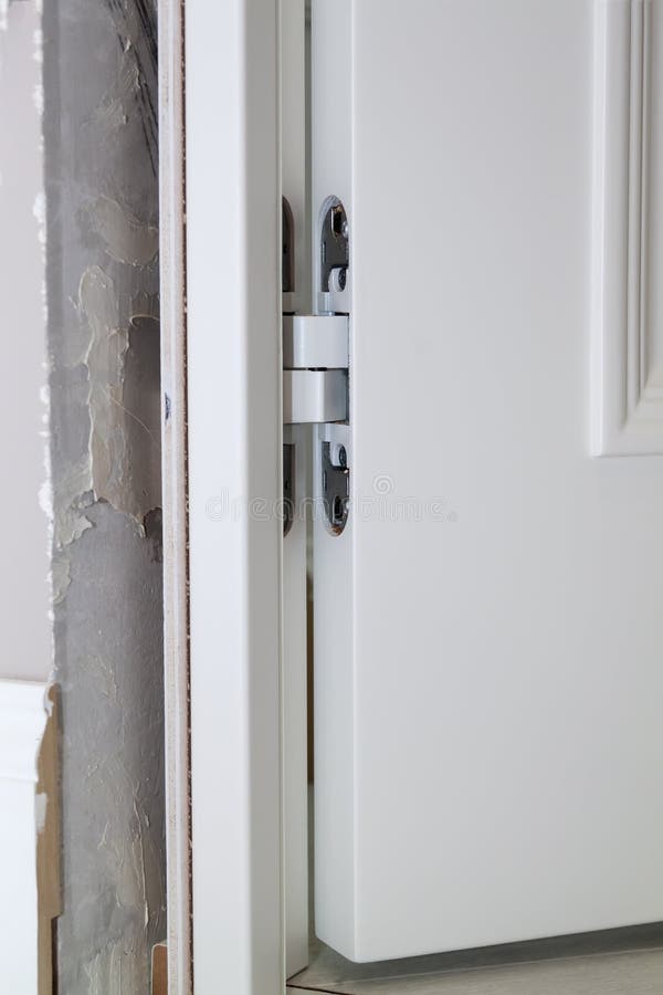 View of Installation of Door in Doorway and Hidden Door Hinge Stock
