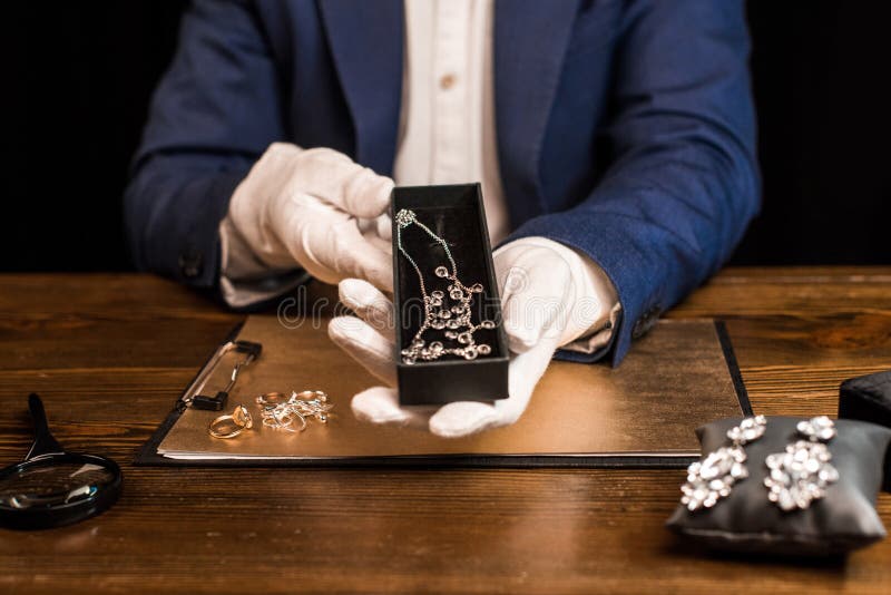 View Of Jewelry Appraiser Holding Box Stock Image - Image ...