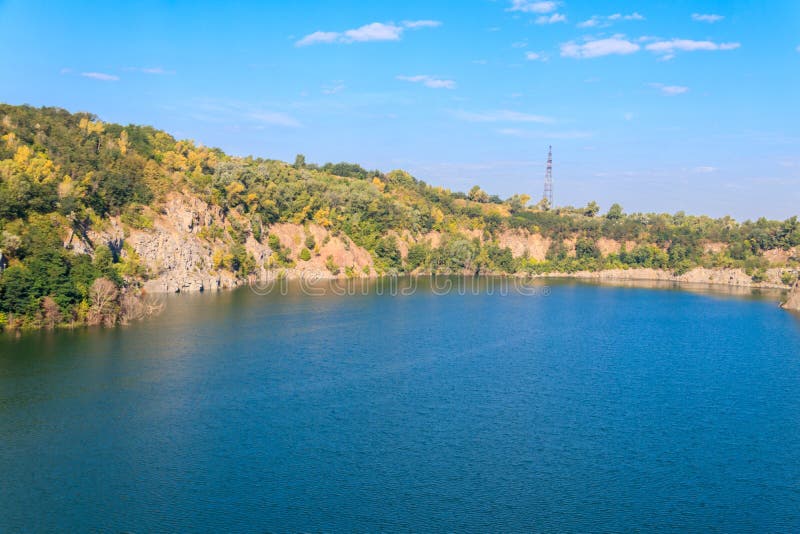 View of lake at abandoned quarry on summer royalty free stock photo View of lake at abandoned quarry on summer royalty free stock photo