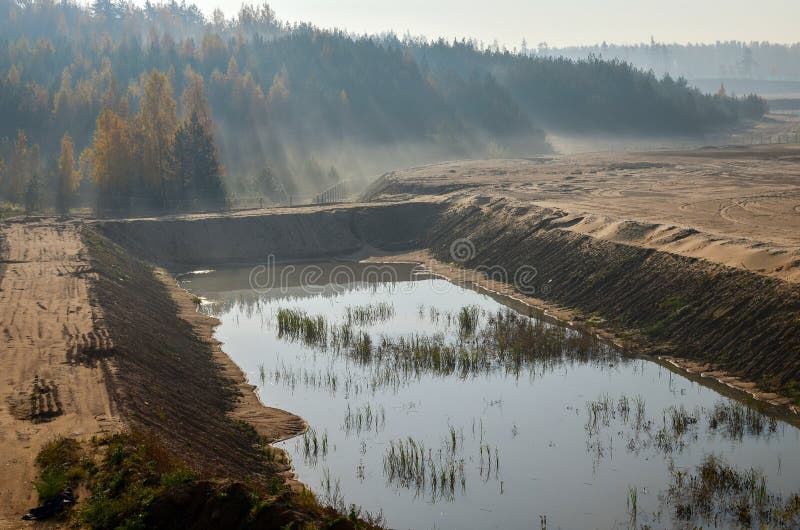 View of the large sand pit. Production useful minerals. stock photos View of the large sand pit. Production useful minerals. stock photos