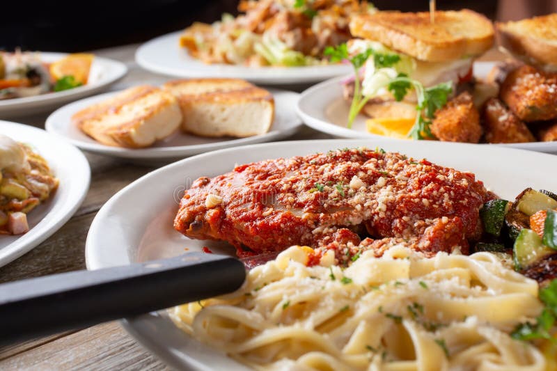 Several Entrees, Plate of Chicken Parmigiana Pasta, Parmesan Stock