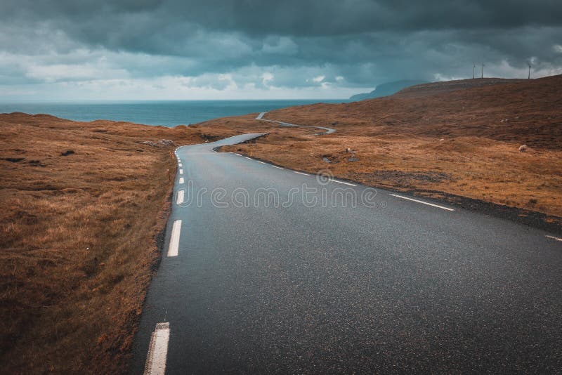 View of a lonely and winding road in the Faroe Islands