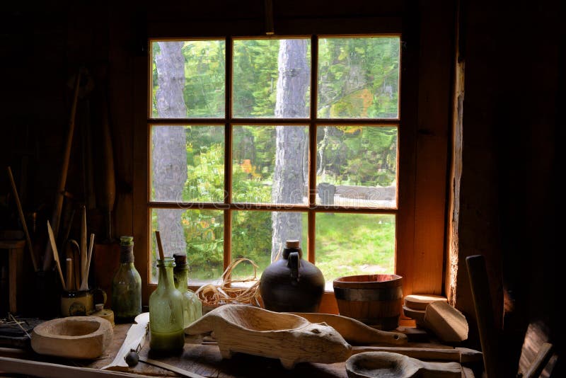 View looking out an old window with antique items stock photos