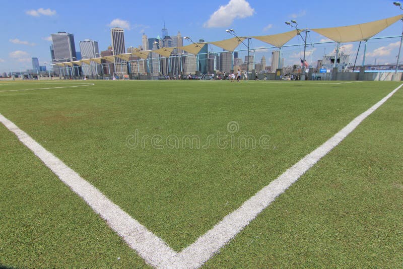 View of Manhattan from Brooklyn Heights Over a Soccer Field Stock Photo