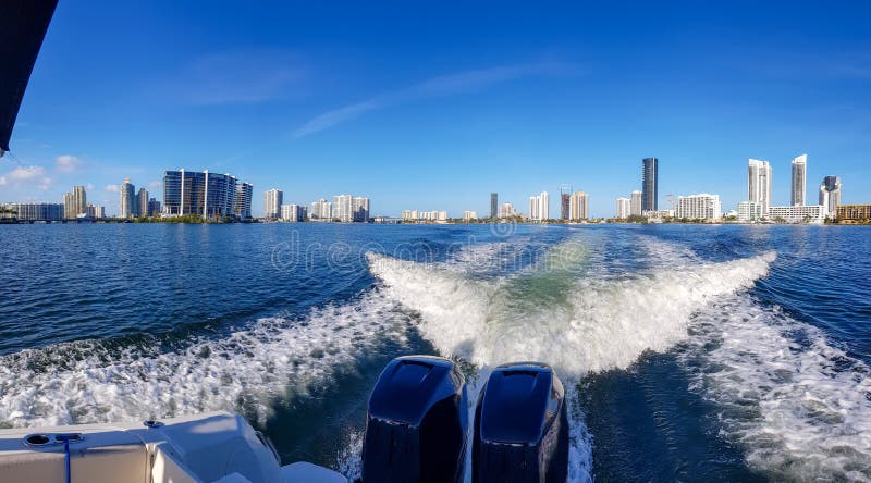 View of Miami skyline from the back of a boat day trip in one of the canals that opens to the ocean. Modern buildings stock photography View of Miami skyline from the back of a boat day trip in one of the canals that opens to the ocean. Modern buildings stock photography