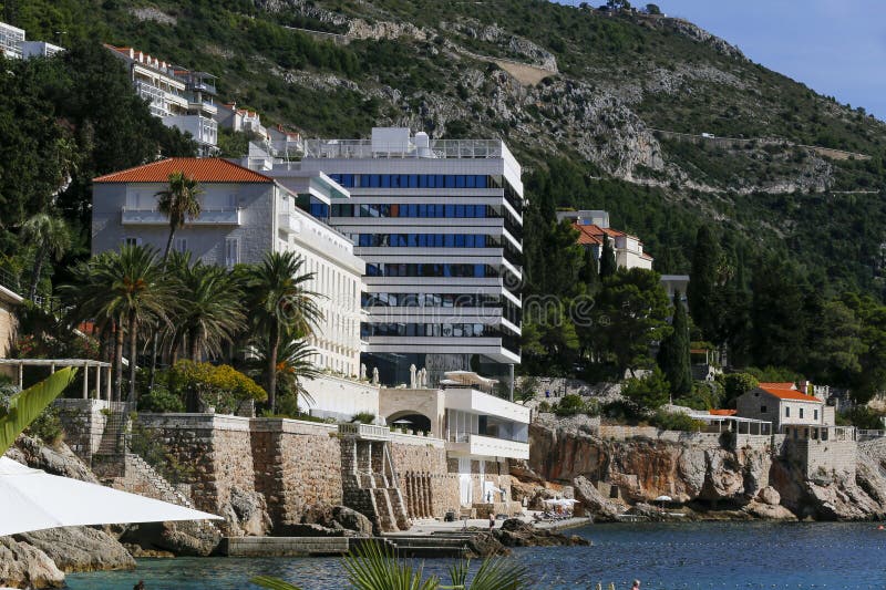View of modern buildings and villas on the sea coast, on mountain background in Dubrovnik, Croatia