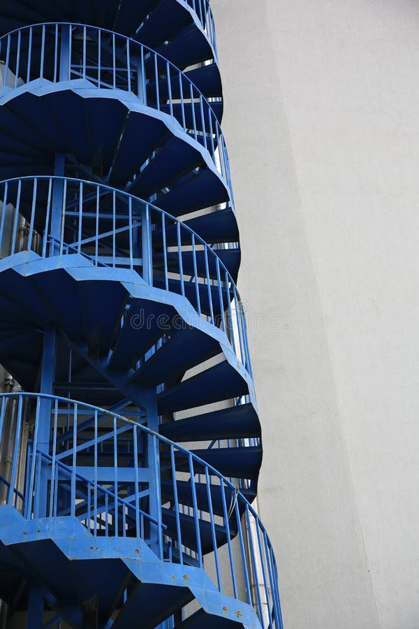 View of Modern Metal Empty Fire Escape Ladder Near Building Outdoors