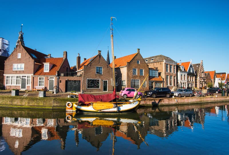 View of Monnickendam old town, Netherlands. Charming canal with boats in Waterland district near Amsterdam.